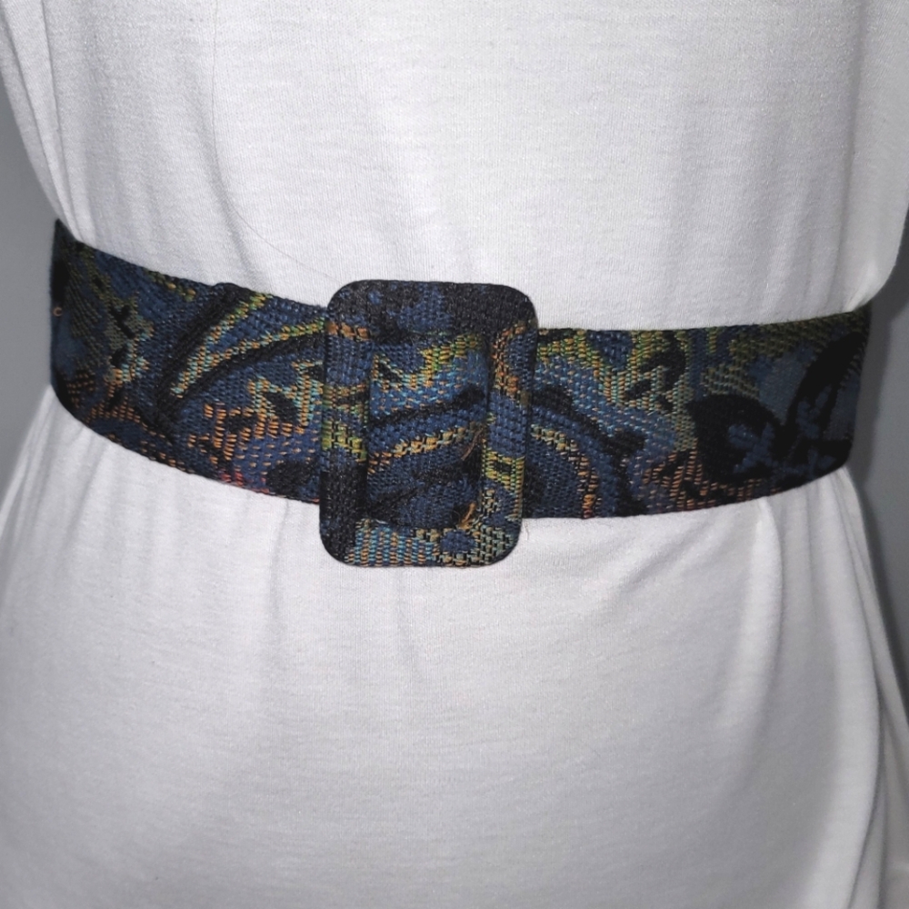 Multi-colored woven fabric belt w/leather back. SZ S